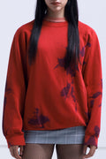 RED SWEATER INTERVENED X ALDO CHAPARRO