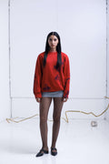 RED SWEATER INTERVENED X ALDO CHAPARRO